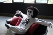 Okasaki mascot 'Okasaemon' relaxes at home.