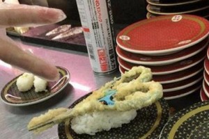 Part time workers deep fry scissors at sushi store